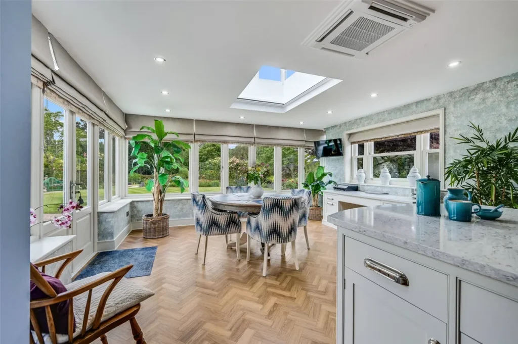 bright open plan kitchen diner with skylight and ceiling cassette air con