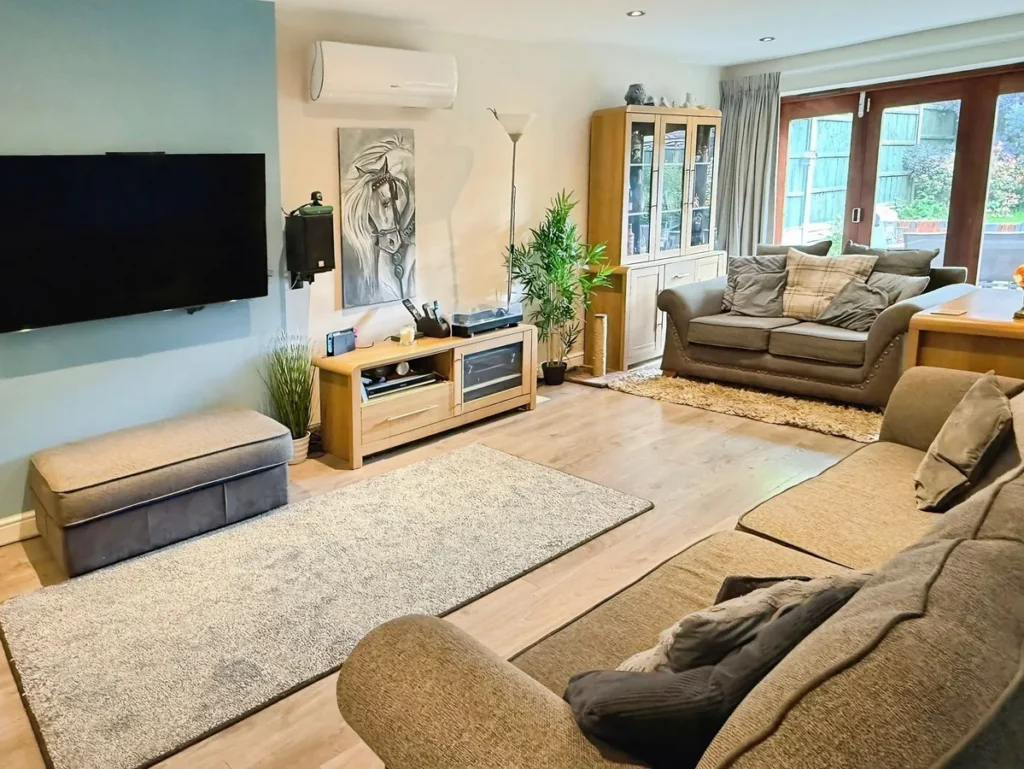 wall mounted air conditioning unit in a living room in heston